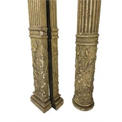 Three 19th century wood and gesso Composite order architectural architraves - curled acanthus leaf capitals over fluted shafts, the bases decorated with guilloche moulding over trailing laurel leaf branches, one half columns, one L-shaped rectangular pilaster and one full column, the largest - H204cm