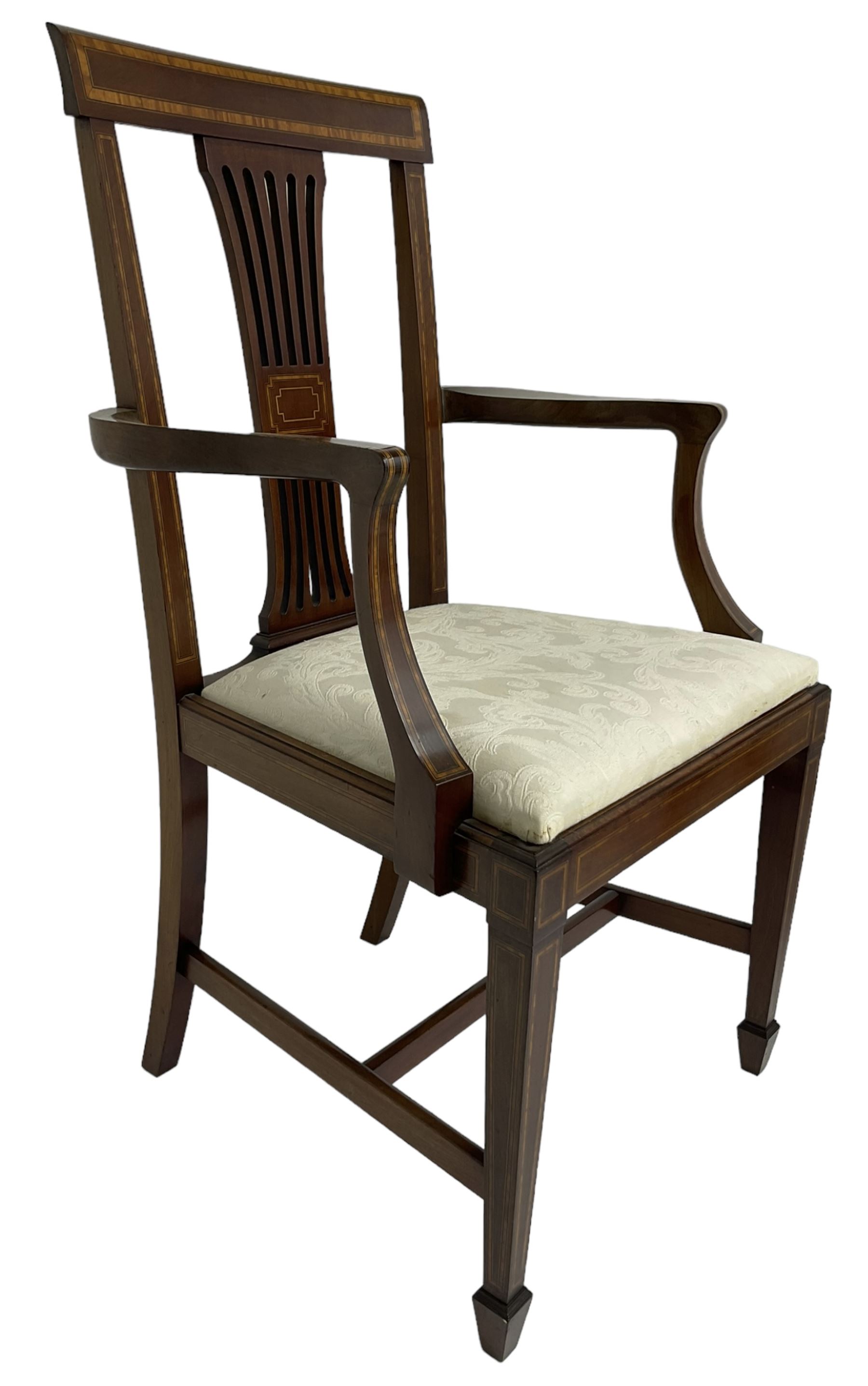 Set of four (2+2_ Edwardian inlaid mahogany dining chairs, cresting rail with satinwood banding, pierced splat backs with central inlay, drop-in seats upholstered in foliate patterned ivory fabric, raised on square tapering supports terminating in spade feet