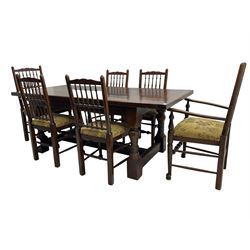 Oak refectory dining table, rectangular cleated top on turned supports joined by H-stretcher; together with set of six (4+2) oak spindle back dining chairs, with upholstered drop-on seat cushions, turned supports joined by turned stretchers