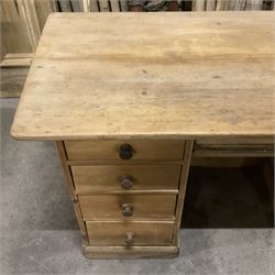 Victorian pine twin pedestal desk, rectangular to over four drawers, central shallow drawer and panelled cupboard, the removable top reveals hidden storage compartments, on skirted base - THIS LOT IS TO BE COLLECTED BY APPOINTMENT FROM THE OLD BUFFER DEPOT, MELBOURNE PLACE, SOWERBY, THIRSK, YO7 1QY