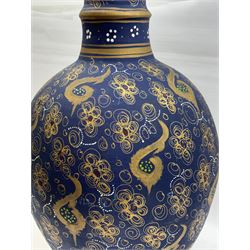 Large and unusual terracotta floor vase, of ovoid form with tall flared neck with frilled rim, decorated with stylised foliate motifs in gilt upon a dark blue ground, H89cm