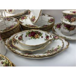 Royal Albert Old Country Roses pattern part tea and dinner service, to include two tureens, eight dinner plates, six side plates, twelve bowls, two mugs, seven teacups and saucers, milk jug,  twelve cake plates, six soup bowls and saucers, candlesticks, etc (95)