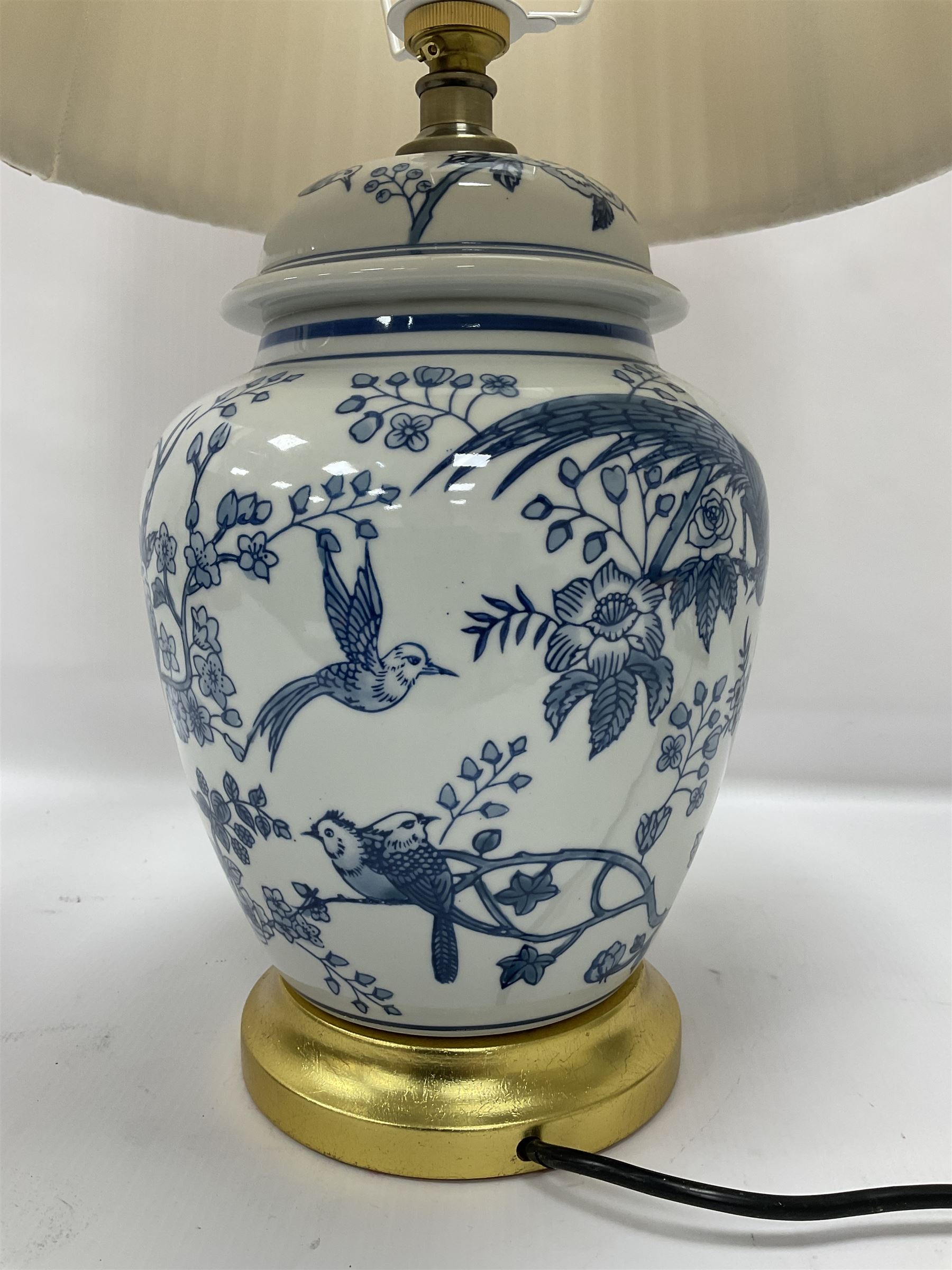 Table lamp of baluster form, decorated with exotic birds up fruiting trees, on gilt chrome pedestal, including shade H554cm