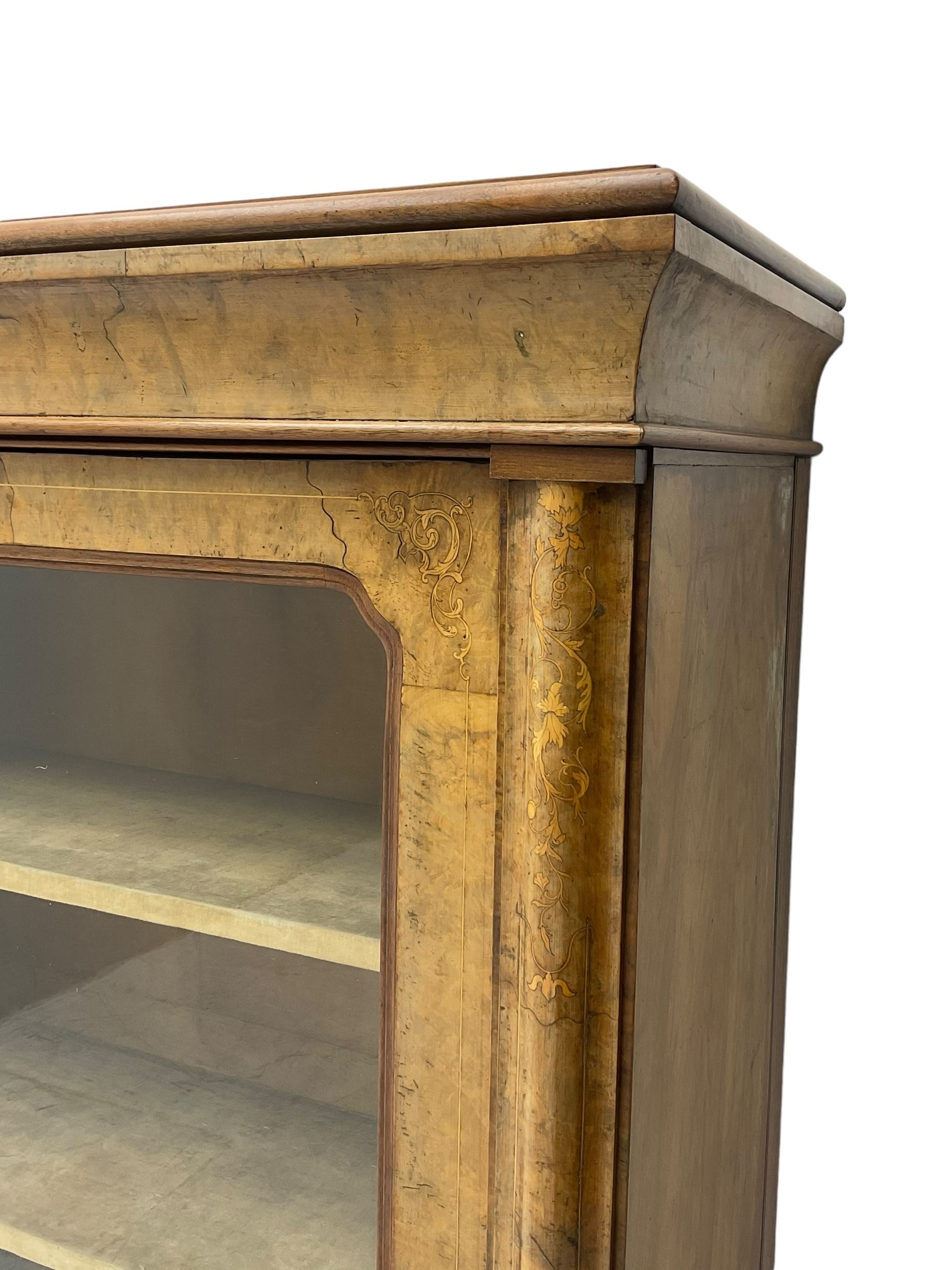 Victorian inlaid walnut pier display cabinet, moulded rectangular top over cavetto frieze, the moulded upright inlaid with scrolling foliage, fabric lined interior fitted with two shelves enclosed by single glazed door, on moulded plinth base 