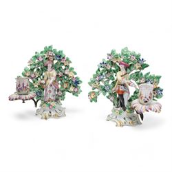 Pair of Bow porcelain 'New Dancers' candlesticks, standing before flowering bocages, and w...