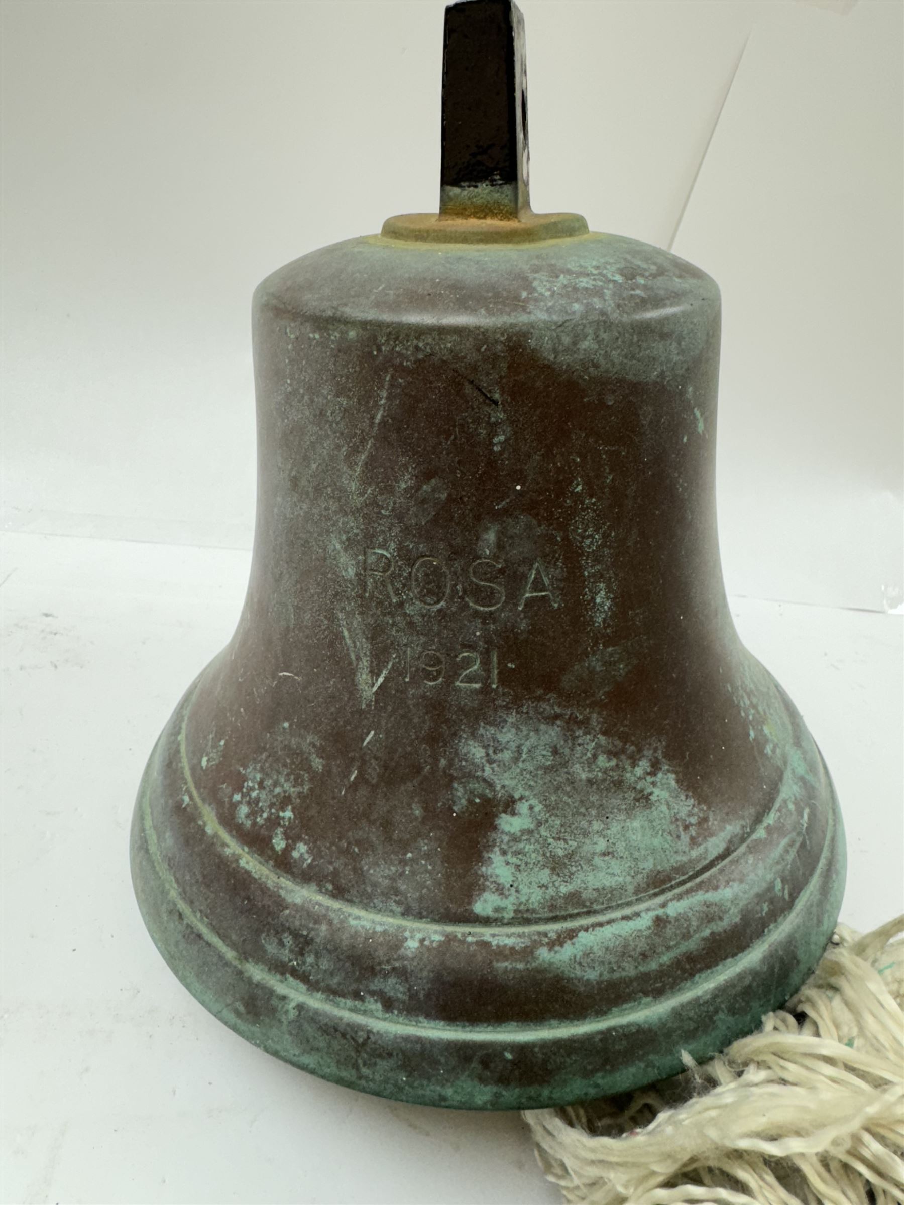 Early 20th century bronze ship's bell, inscribed 'Rosa 1921', with plaited rope pull, H19cm