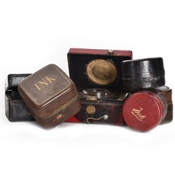 Six leather bound travelling inkwells, to include Berry's Patent example, all with glass liners