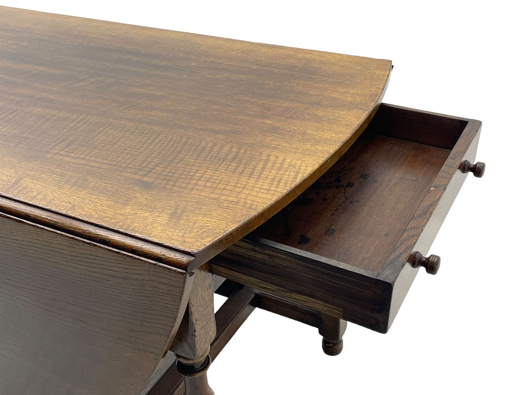 Titchmarsh & Goodwin - 17th century design oak drop leaf dining table, oval top with hinged drop leaves, single drawer to one side with applied makers label, baluster-turned supports united by stretchers