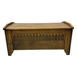 20th century oak coffer or blanket chest, rectangular hinged top over repeating Gothic arch carved front and shaped sides, constructed with pegged joints, on stile supports