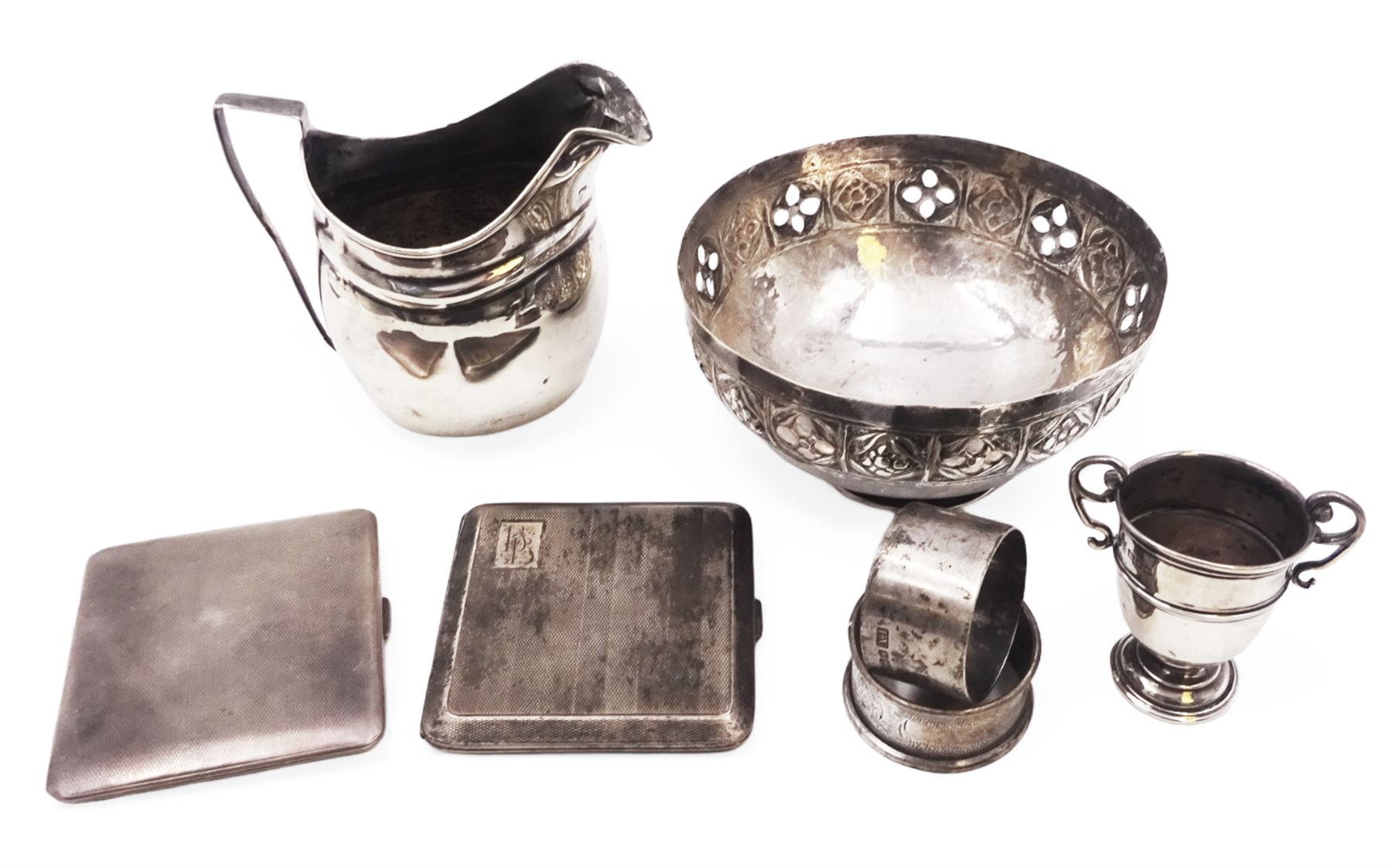 Group of silver, comprising milk jug, miniature trophy, napkin rings and cigarette cases, all hallmarked together with a continental silver bowl with pierced sides, jug H10cm