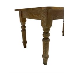 Limed oak dining table, rectangular top with rounded corners, on turned supports