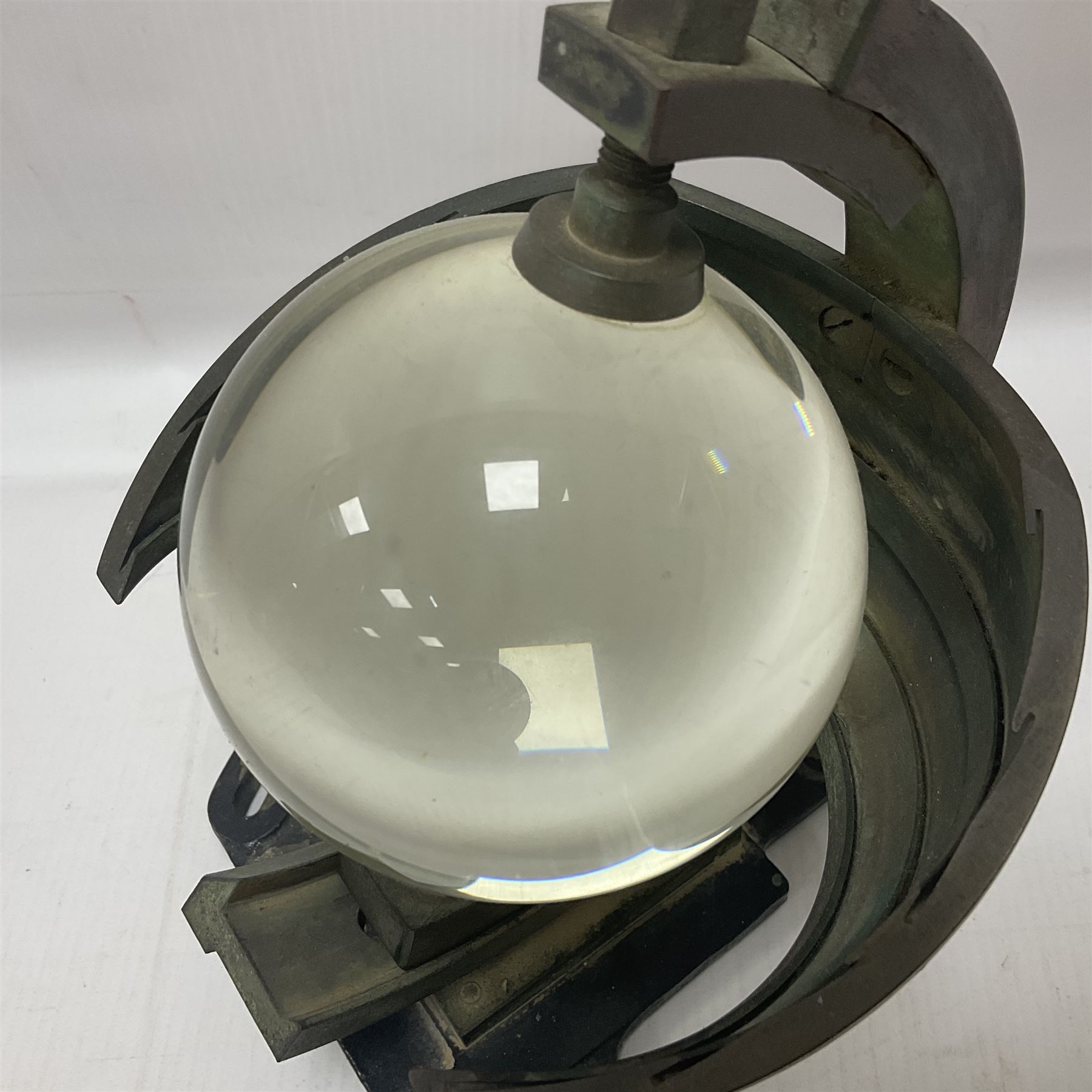 Sunshine recorder by Casella London, No 5997, a glass sphere mounted into a curved brass plate, H22cm