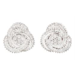 Pair of 9ct white gold round brilliant cut and baguette cut diamond flower head swirl stud...