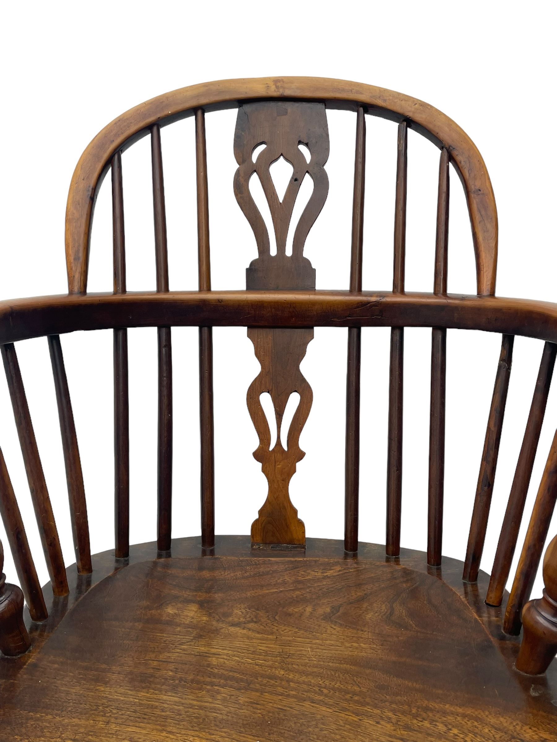 19th century yew wood and elm Windsor armchair, low double hoop stick and pierced splat back, dished seat on turned supports united by crinoline stretchers