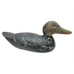 Early 20th century American carved wooden decoy duck, with weight beneath marked CJ Raymond Lead Co Chicago, Ill, H18cm, L38cm 