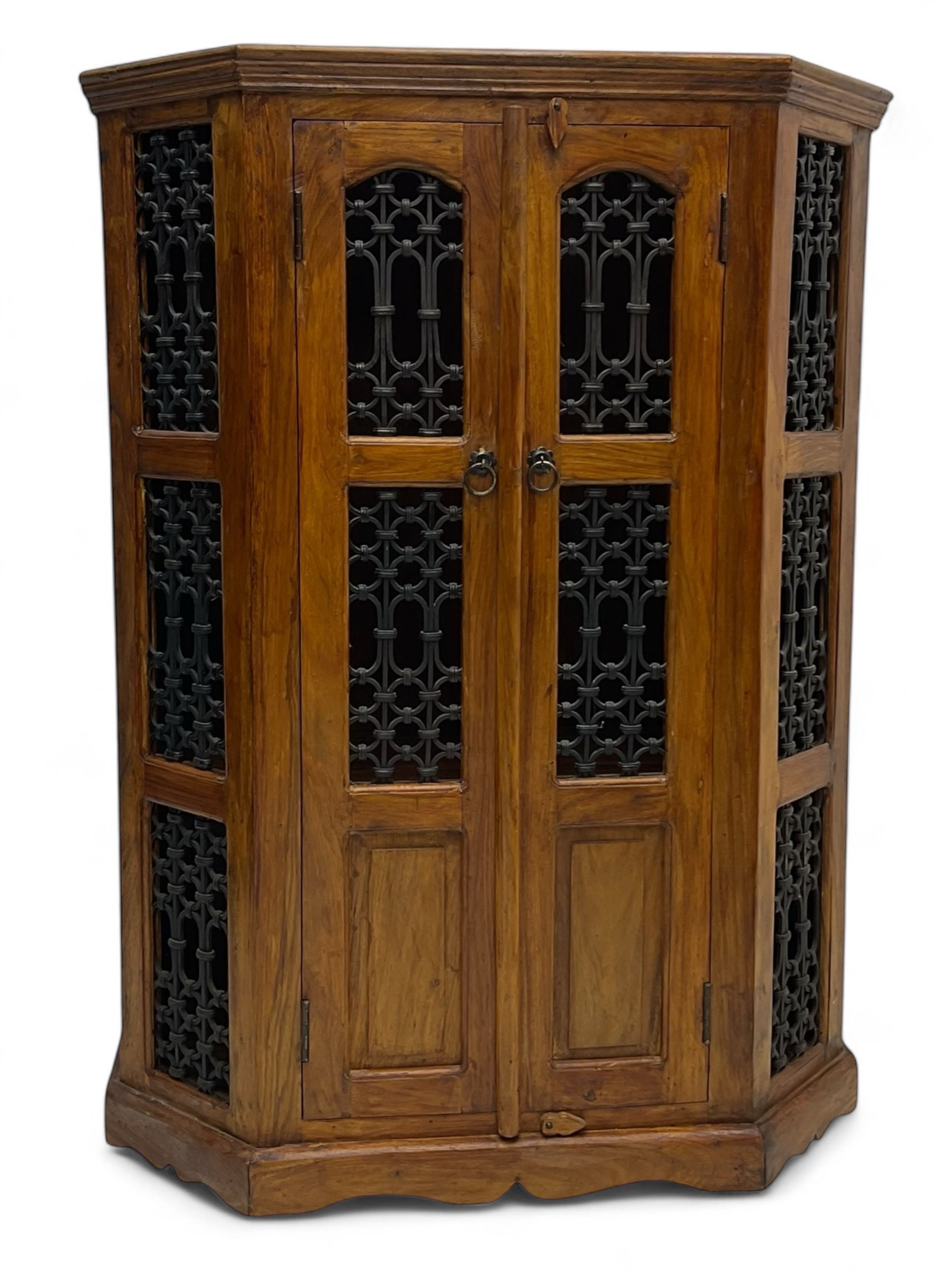 Hardwood and wrought iron cabinet, enclosed by two doors, on plinth base 