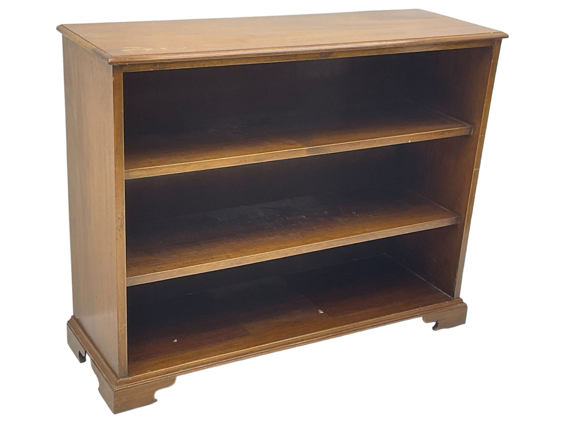 20th century mahogany open bookcase, fitted with two shelves, on bracket feet