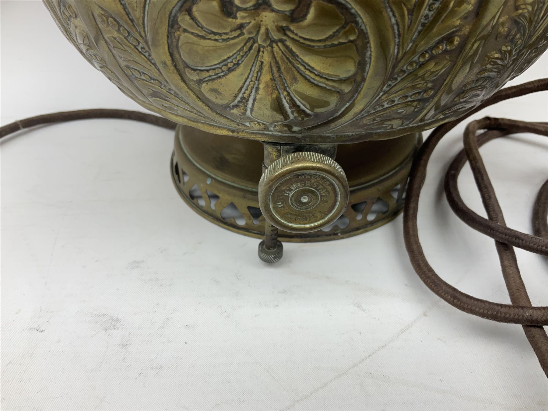 Victorian brass oil lamp converted to electricity, the square stepped base with a reeded doric column leading to a cut clear glass reservoir and burner and spherical shade with printed bird decoration, together with another similar shade and oil lamp parts and accessories etc