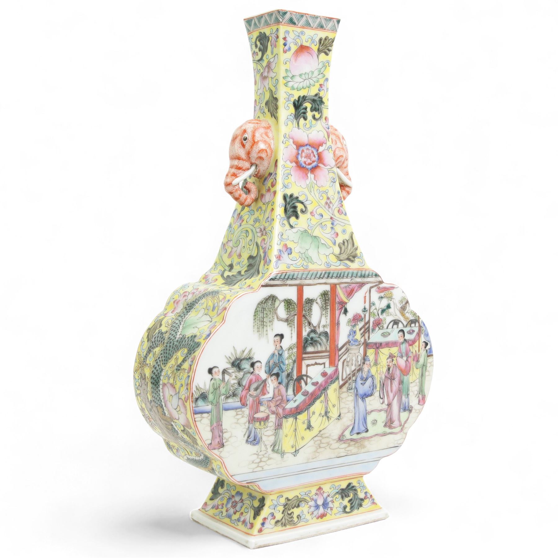 20th century Chinese famille rose vase, the flared neck with twin elephant mask handles above a lobed body and rectangular splayed foot, the body painted with figures in a garden terrace, against a foliate yellow ground, underglaze six-character mark beneath, H34cm