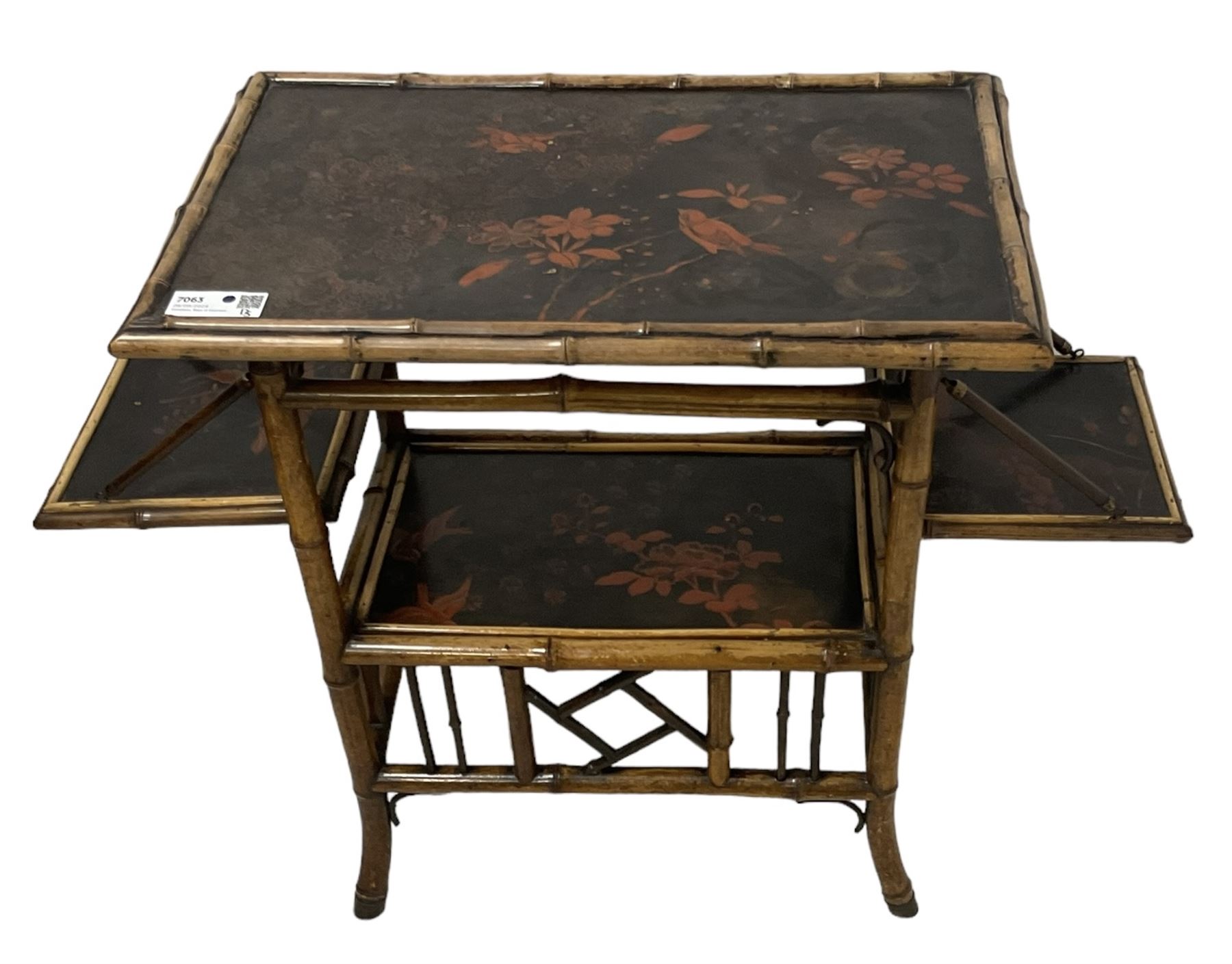 Late 19th century Aesthetic Movement lacquered and painted bamboo occasional table, rectangular top painted with Japanned traditional bird and blossom scenes, over two fold-out side leaves and undertier with pierced gallery apron