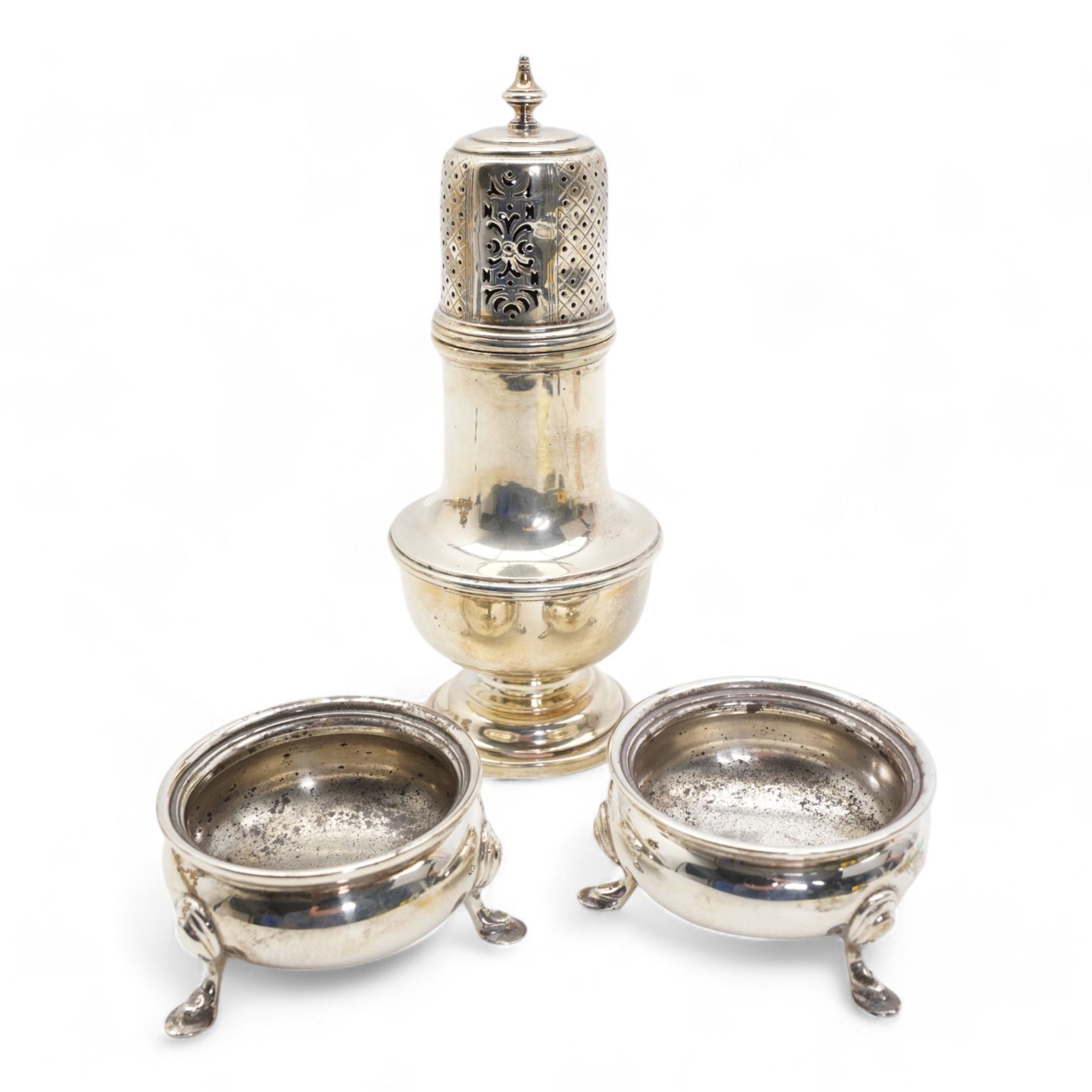 Pair of George III silver salts with later decoration London 1772 Maker Robert Hennell I, silver sugar caster Birmingham 1922, pair of 19th century silver sugar tongs and a silver backed hand mirror