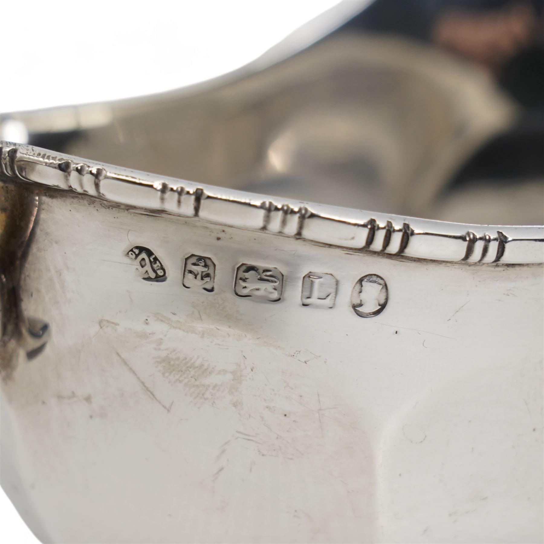 Pair of silver panel sided sauce boats with leaf capped C scroll handles Birmingham 1935 Maker Adie Brothers