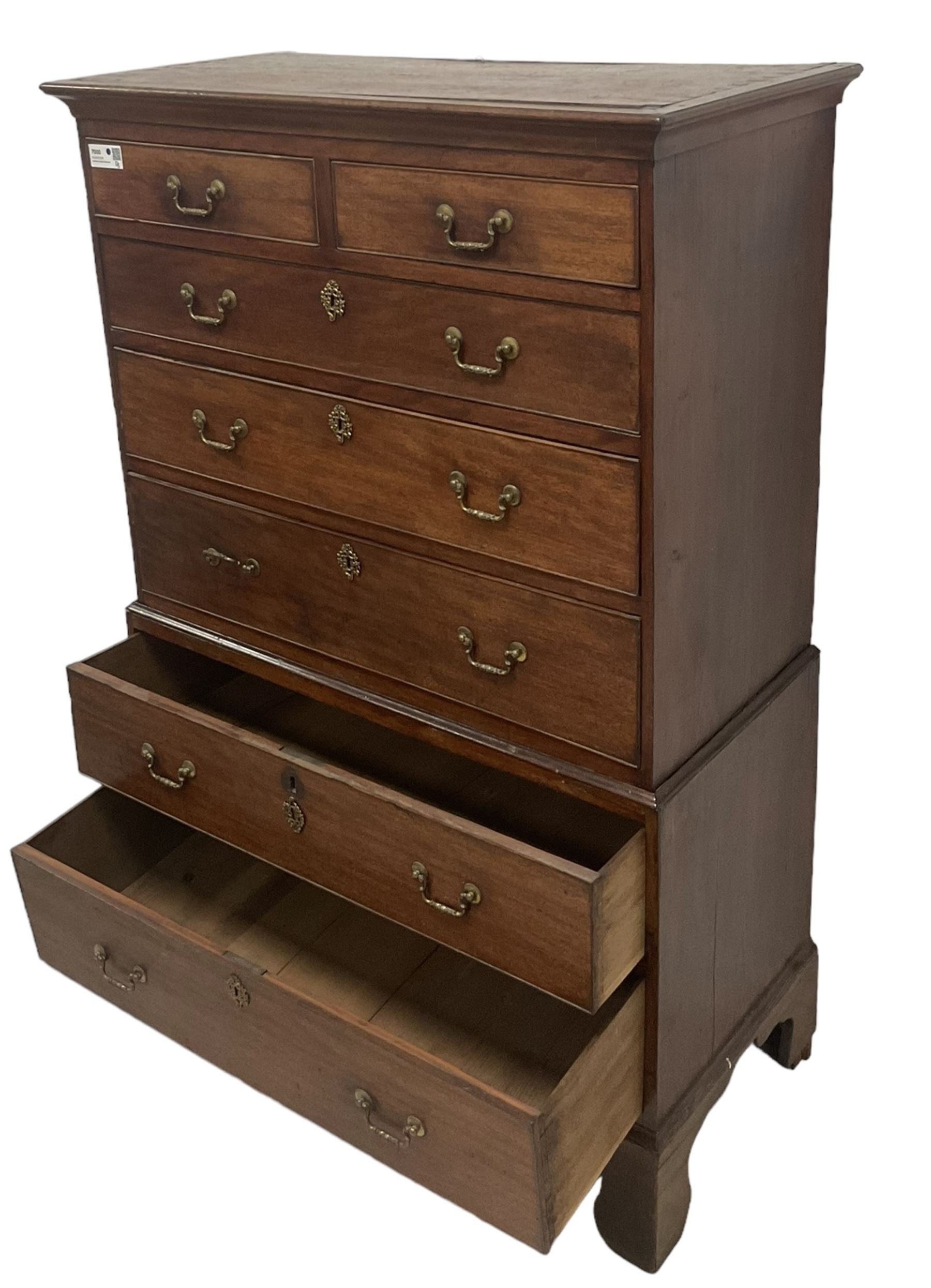 George III mahogany chest-on-chest, projecting cornice over two short and five long graduating cock-beaded drawers, each fitted with original brass swan neck handles, raised on bracket feet