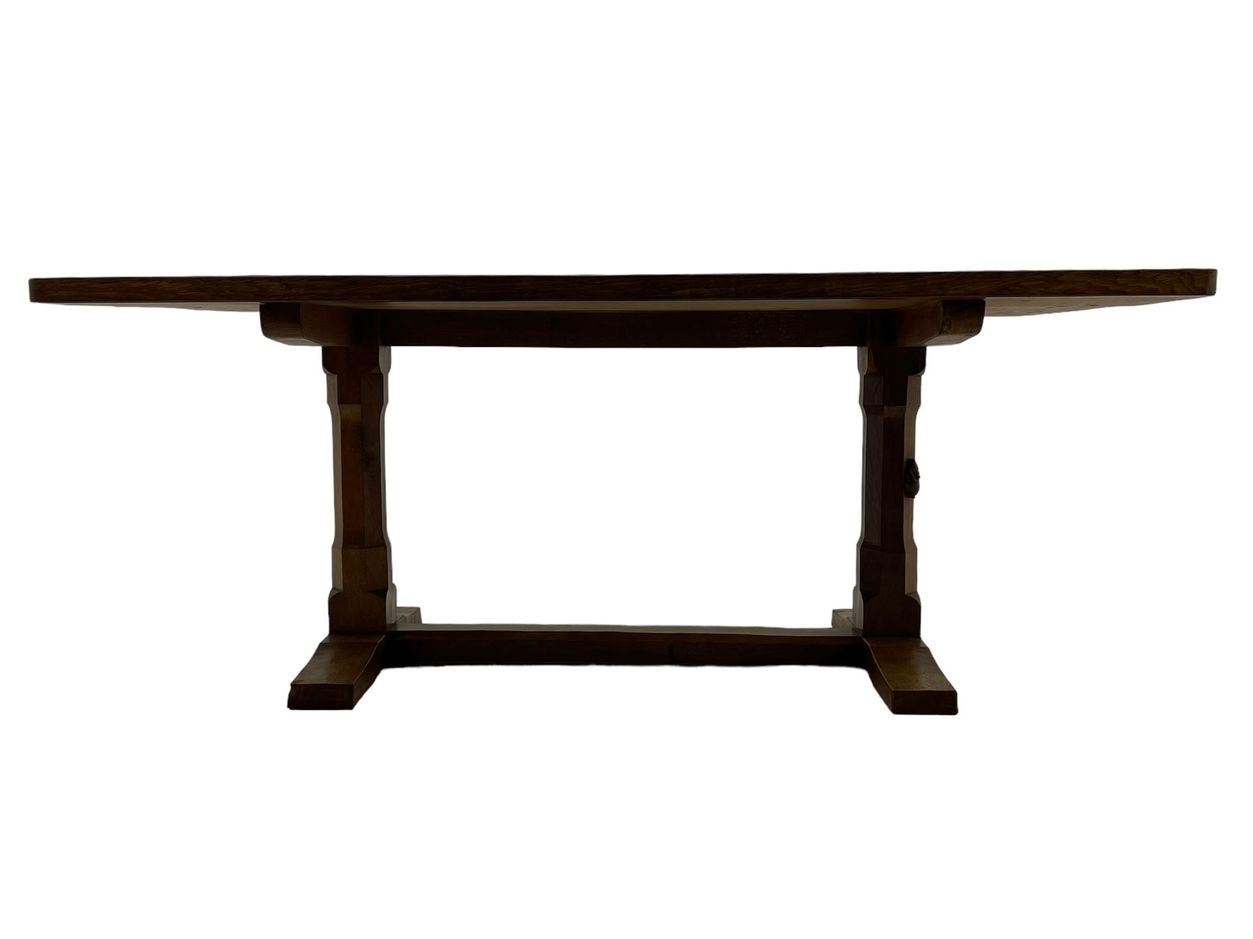 Rabbitman - oak dining table, rectangular adzed top, twin octagonal pillar supports on sledge feet, united by floor stretcher, carved with rabbit signature, by Peter Heap of Wetwang 