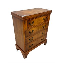 Georgian design yew wood bachelor's chest, fold-over rectangular top supported by pull-out stays, fitted with four long cock-beaded drawers, on bracket feet