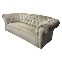 Chesterfield shaped button-tufted sofa, upholstered in pale beige velvet fabric with rolled arms, decorative rope trim and ruched detailing