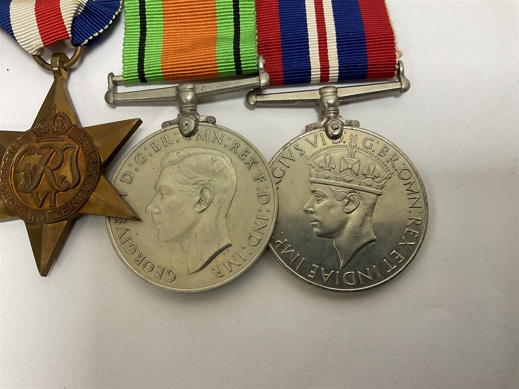 WWII group of six medals comprising 1939-45 Star, The Africa Star, The Italy Star, France and Germany Star, Defence Medal and War Medal 1939-45, awarded to 7899181 RAC C.W Hughes, together with two chevrons and ephemera relating to Charles William 'Bill' Hughes including Soldier's Release Book, photographs, certificates of transfers etc 