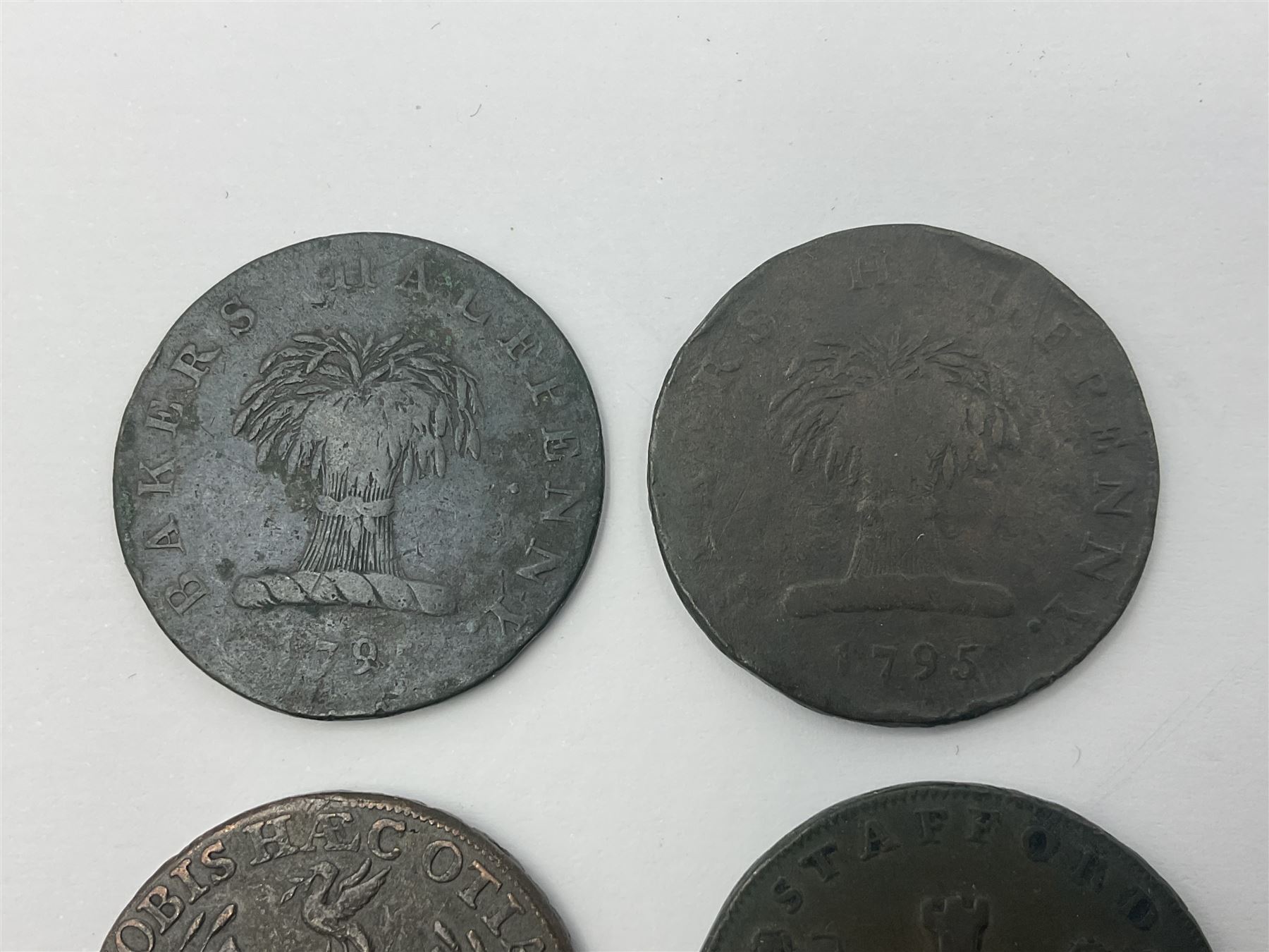 Four Georgian tokens comprising 1791 Liverpool Thomas Clarke Halfpenny, two 1795 Bakers Halfpennies and 1797 Stafford Halfpenny 