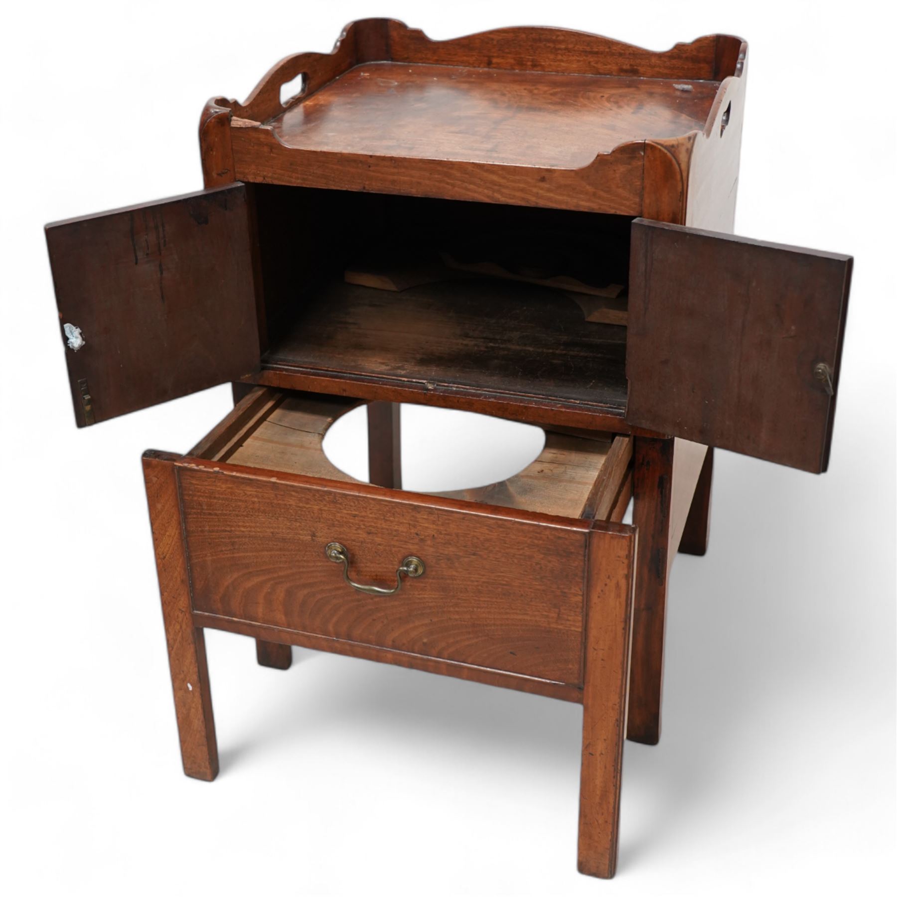 George III mahogany night commode, tray-top with pierced handles, fitted with cupboard over commode drawer, on square moulded supports