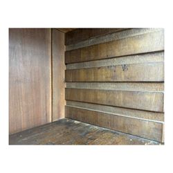 Early 19th century mahogany bureau bookcase, the projecting cornice over two Gothic-style astragal glazed doors enclosing two adjustable shelves, sloped hinged lid enclosing fitted interior and felt inset, four graduating drawers, on bracket feet