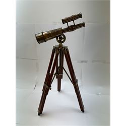 Brass telescope upon a wooden adjustable tripod, H55cm 