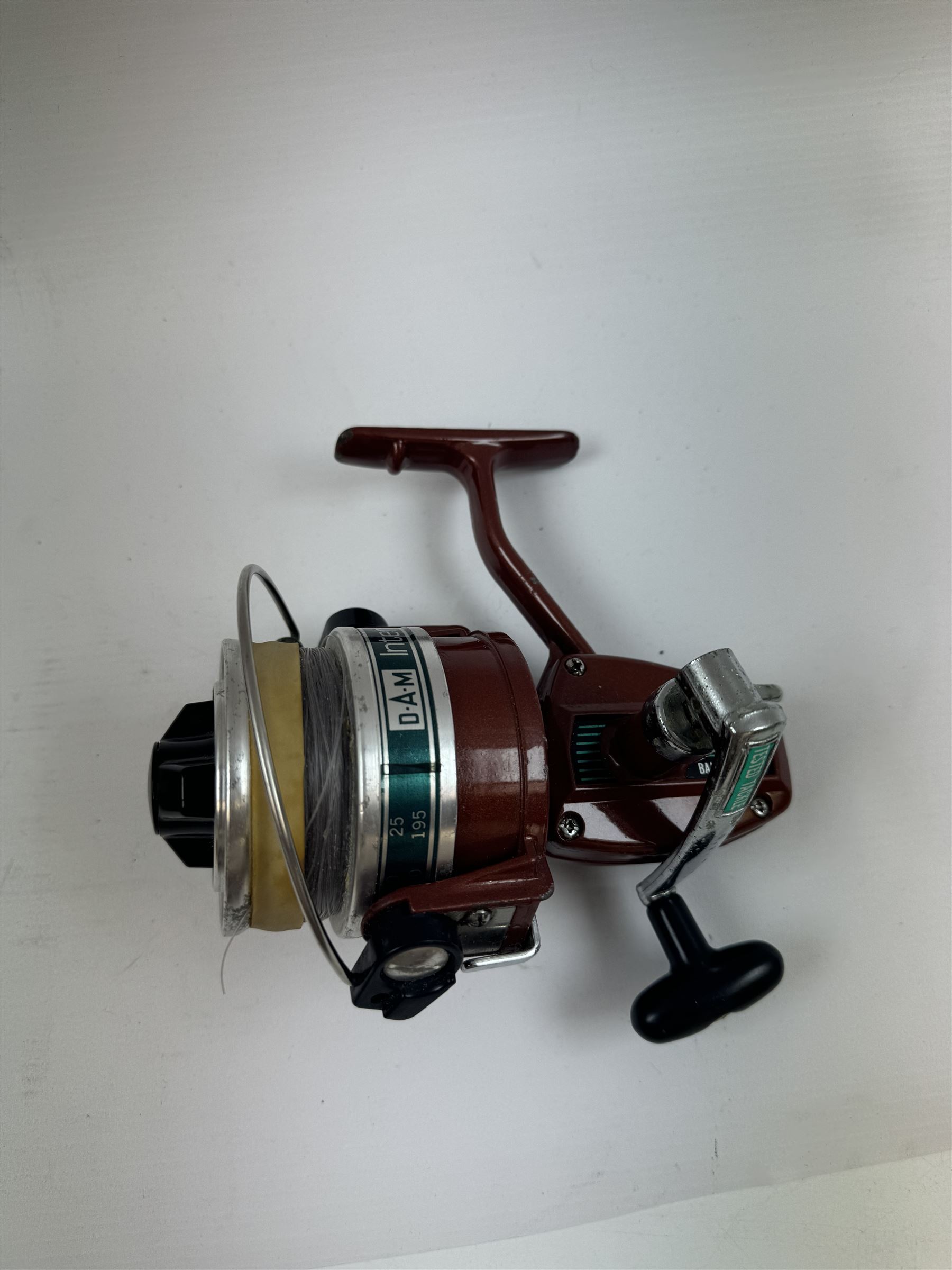 Four fishing reels, Winfield Beach fisher rod, Winfield International 20 , DAM International etc 