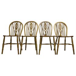 Set of four elm and beech wheelback dining chairs