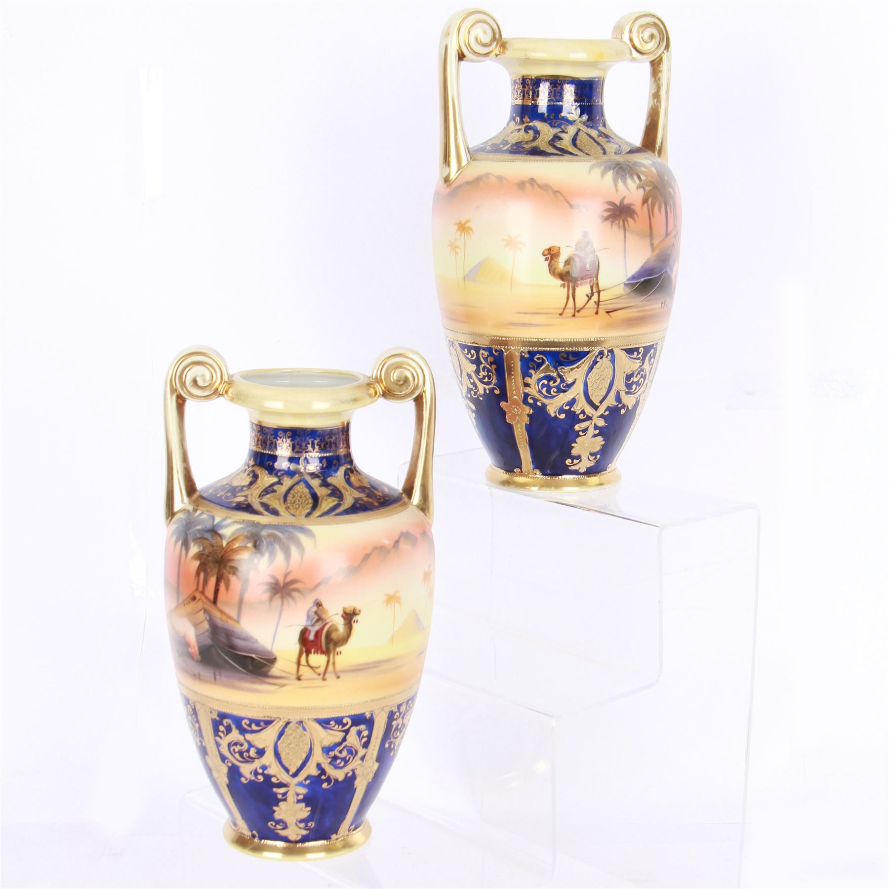 Pair of Noritake twin handled vases, decorated with camel scene, H24cm 