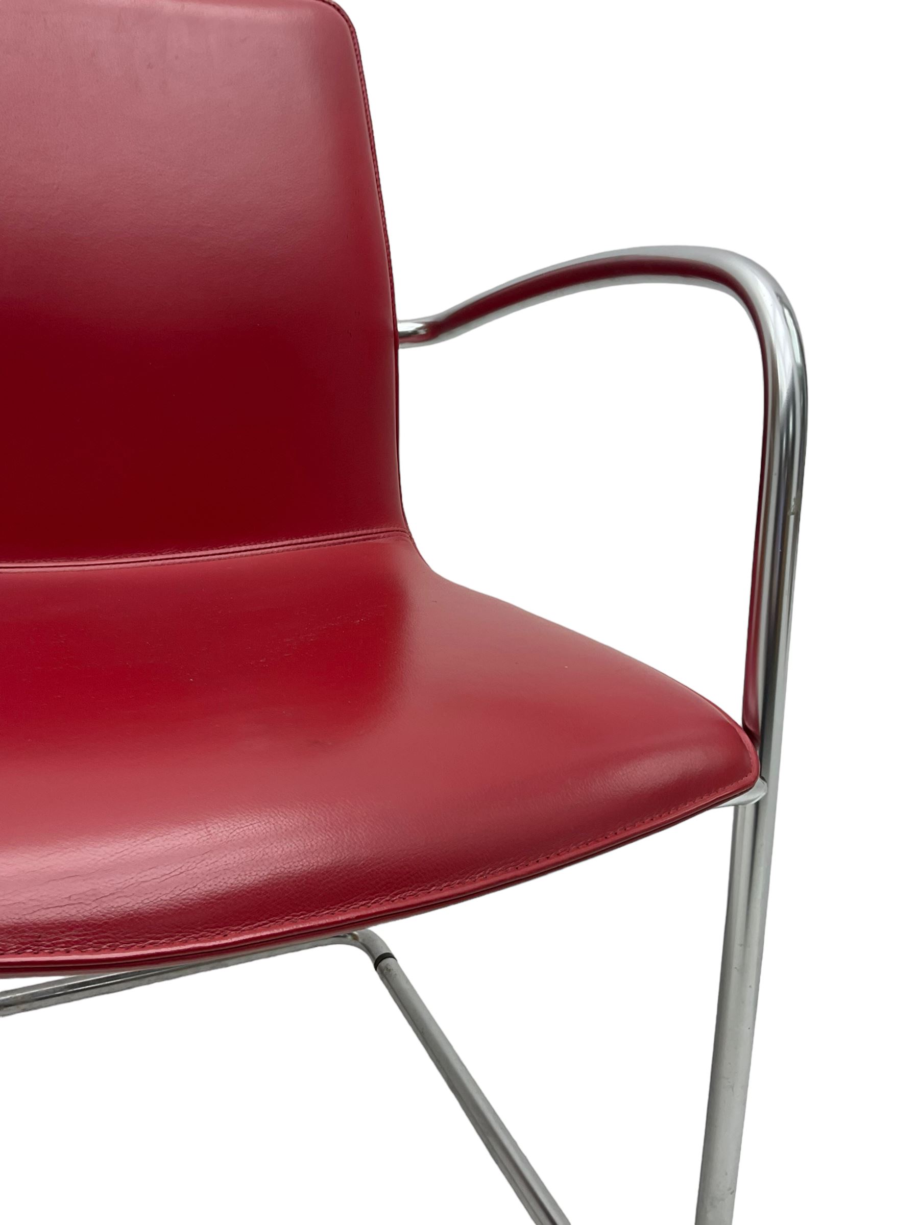 Kusch & Co - contemporary chrome framed armchair upholstered in red leather