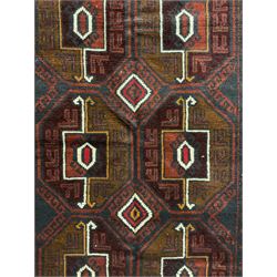 Baluchi red and blue ground rug, the field decorated with large six Gul motifs