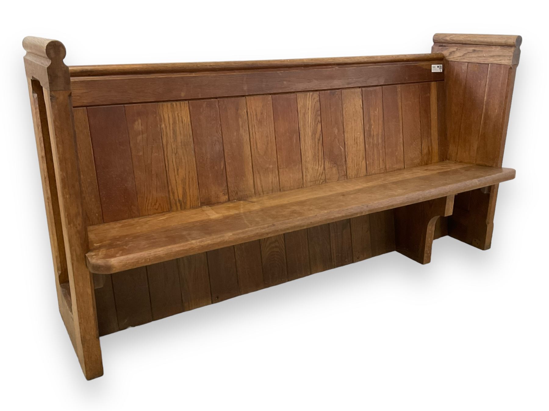 19th century oak church pew or hall bench, moulded cresting rail over panelled back and plank seat, on panelled end supports with chamfered frames