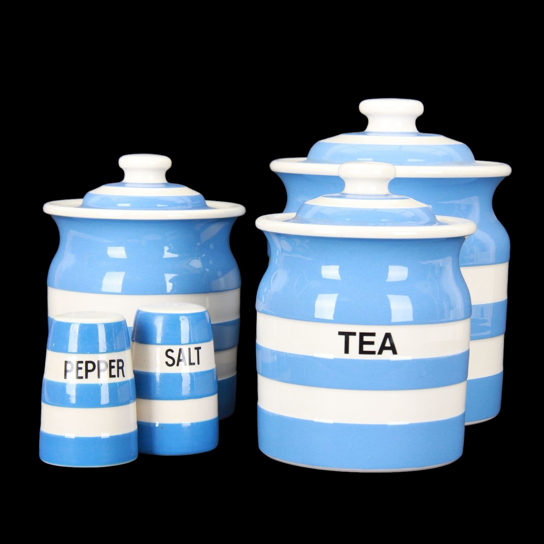 Three T G Green jars, together with salt and pepper shakers