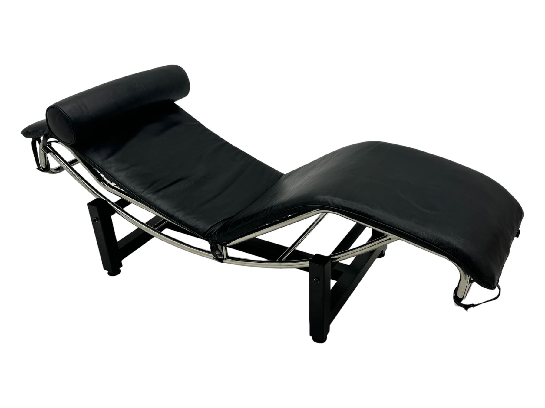 After Le Corbusier, Pierre Jeanneret, and Charlotte Perriand - LC4 chaise longue, black leather upholstery with cylindrical headrest, supported by a chromed tubular steel frame, with cantilever design with elastic webbing