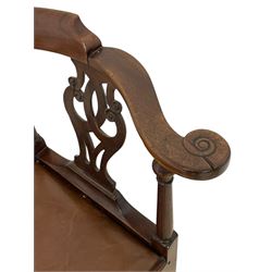 George III mahogany corner elbow chair, curved back rest and shaped arms with scroll carved terminals, on turned supports and pierced scroll carved interlaced splats, drop-in seat upholstered in brown leather, on square supports with inner chamfer and outer moulding 