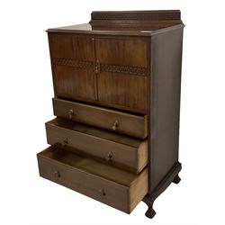 Early 20th century mahogany tallboy, double cupboard over three drawers, on ball and claw carved cabriole feet