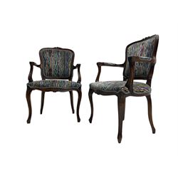 Pair of French design open armchairs, the moulded frame carved with flower heads, upholstered seat, back and arms, on cabriole supports