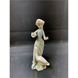 Four Lladro figures, including Girl with Lamb, Girl with Dove etc