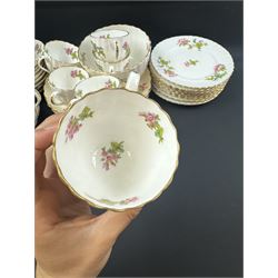 Coalport part tea service, decorated with floral sprigs, including eight cups and saucers, milk jug, eight dessert plates etc  