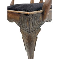 Unusual 18th century mahogany elbow chair, the shaped cresting rail with projecting shell carved ears, pierced and scroll carved splat over drop-in upholstered seat, shaped arms with ball and claw carved terminals, the seat rails carved with shell cartouches, on foliate carved cabriole supports with ball and claw feet 