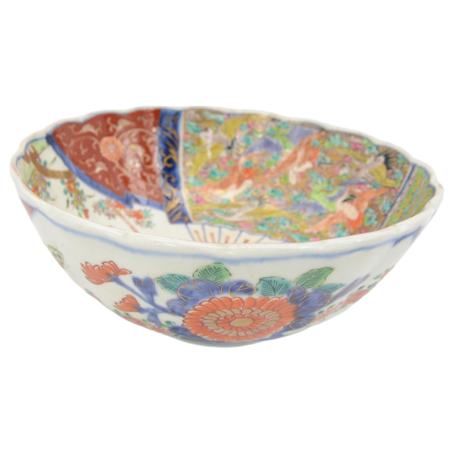 19th century/ early 20th century Chinese Canton blue and white bowl, centrally decorated with a landscape scene, within a famille rose enamelled border and scalloped rim, D26cm together with a Japanese Meiji Imari fluted bowl, decorated cranes, fans and scholar, D24cm (2)